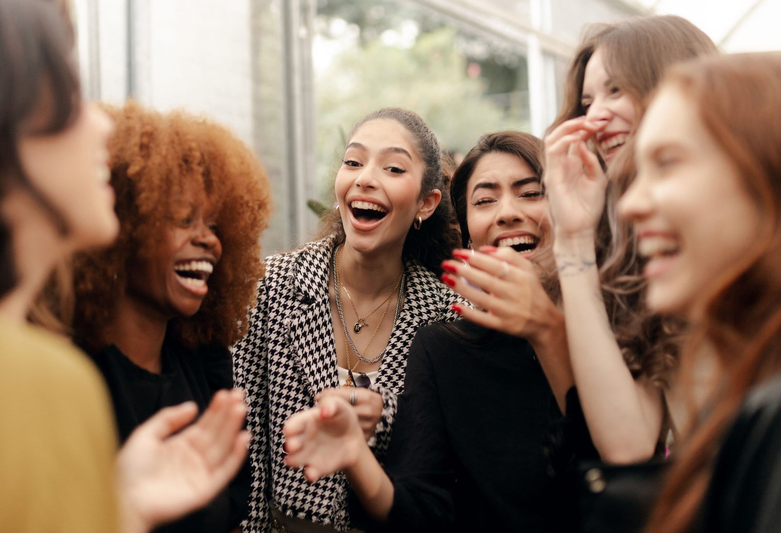 Tips for More Laughter and Less Stress image shows a group of women laughing